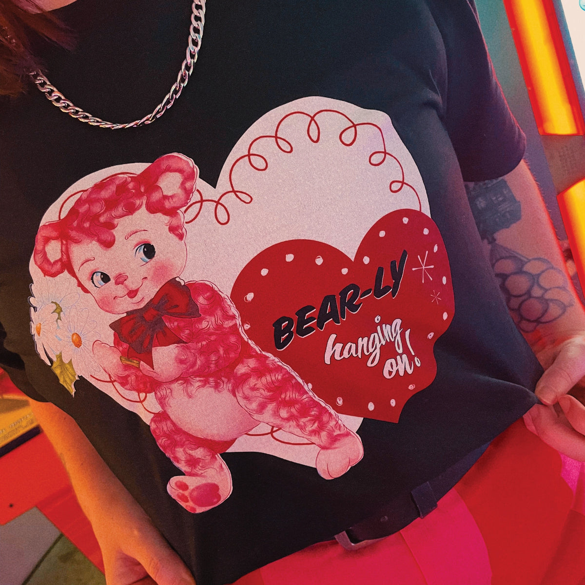 Black unisex t-shirt with Bearly Hanging On graphic by Lonely Kids Club