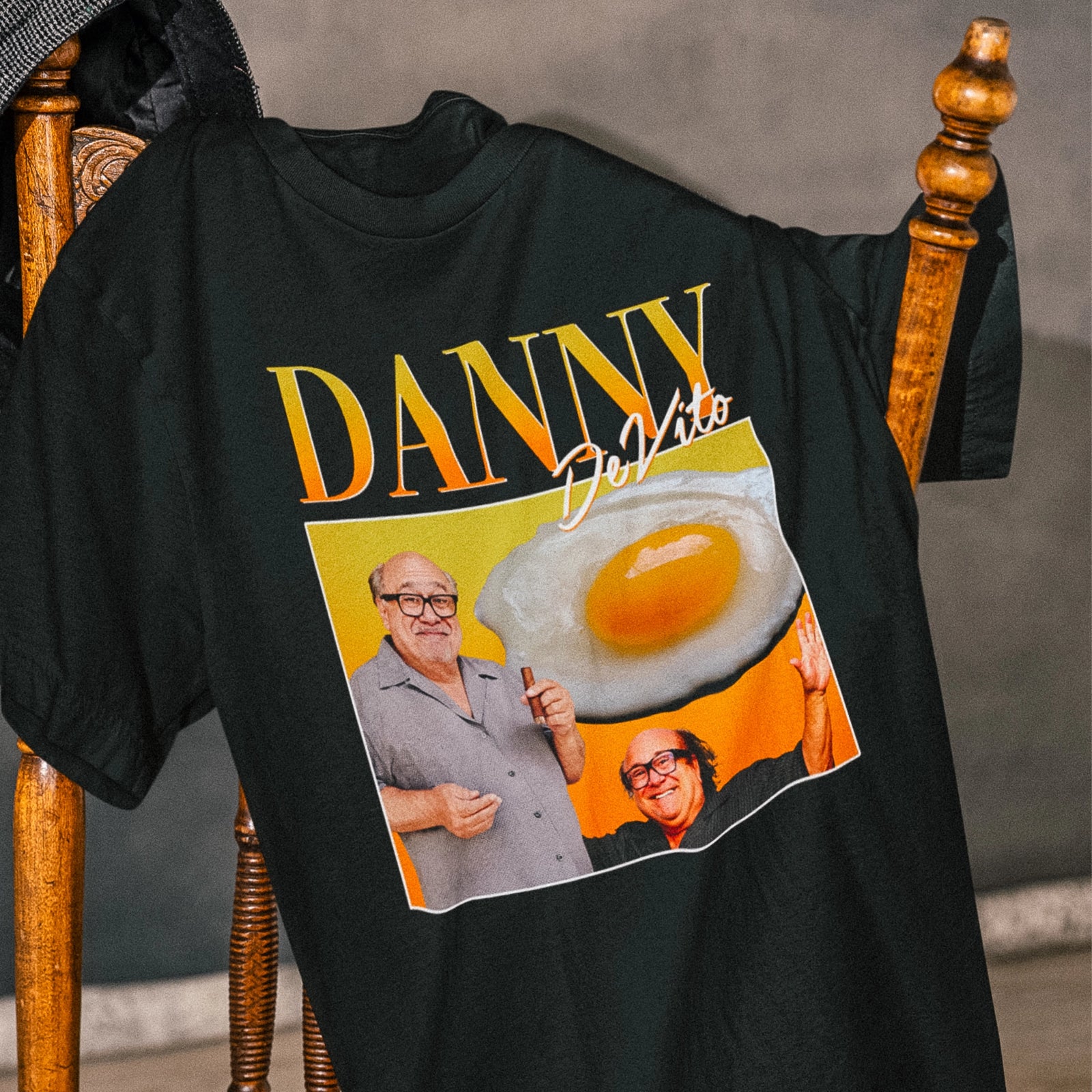 T-shirt with a retro Danny DeVito collage, a fried egg, and 'Danny DeVito' text by Lonely Kids Club