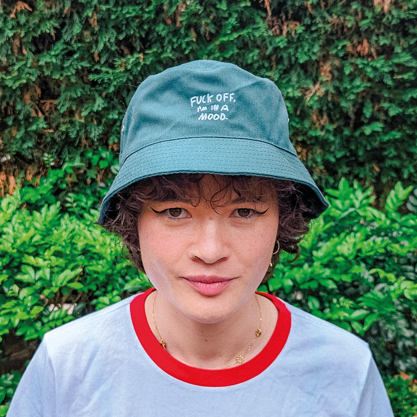 Bottle Green bucket hat with Fuck Off Bucket Hat graphic by Lonely Kids Club