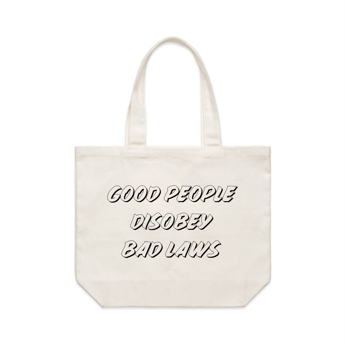 Cream shoulder tote with Good People Disobey Bad Laws Tote graphic by Lonely Kids Club