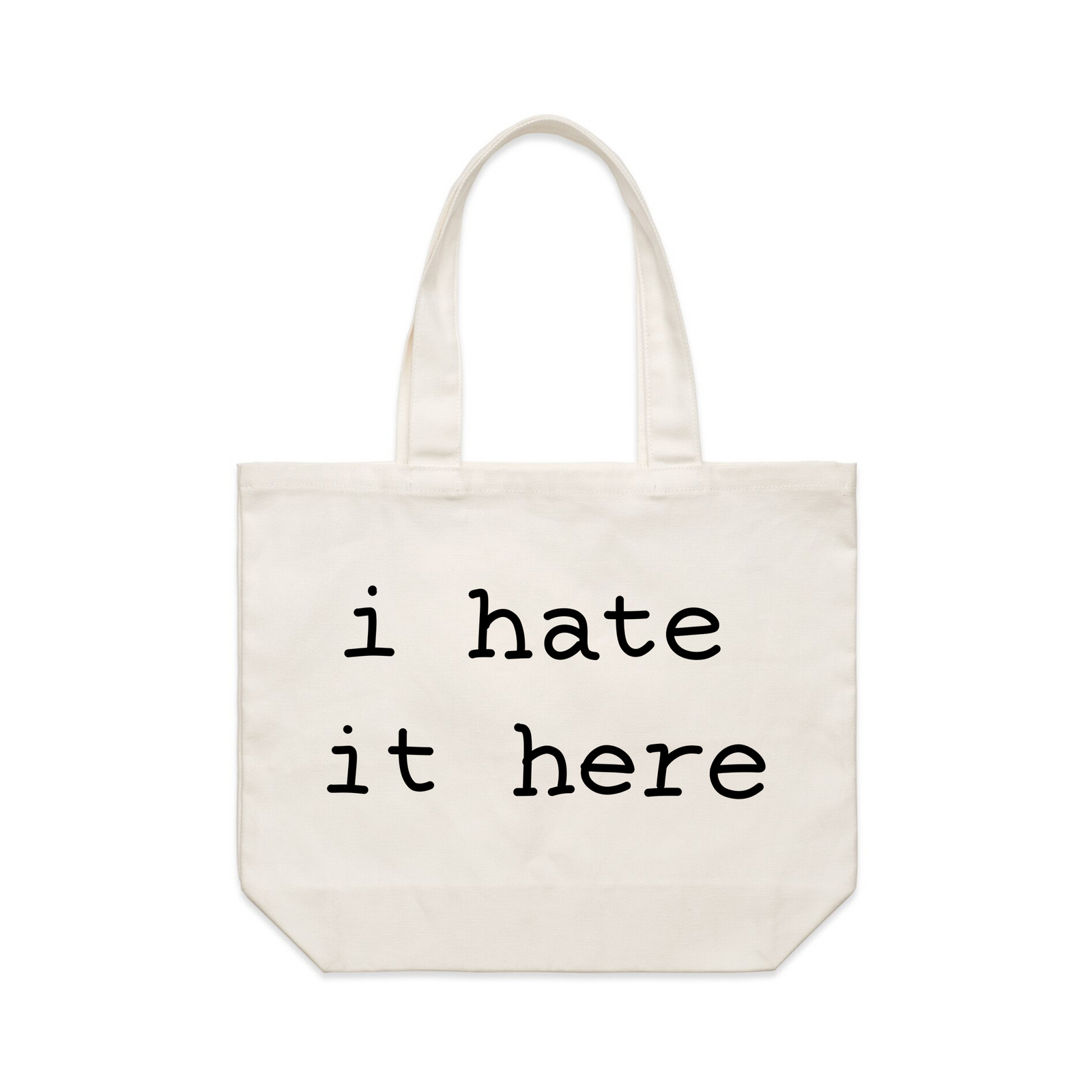Cream shoulder tote with I Hate It Here Tote graphic by Lonely Kids Club