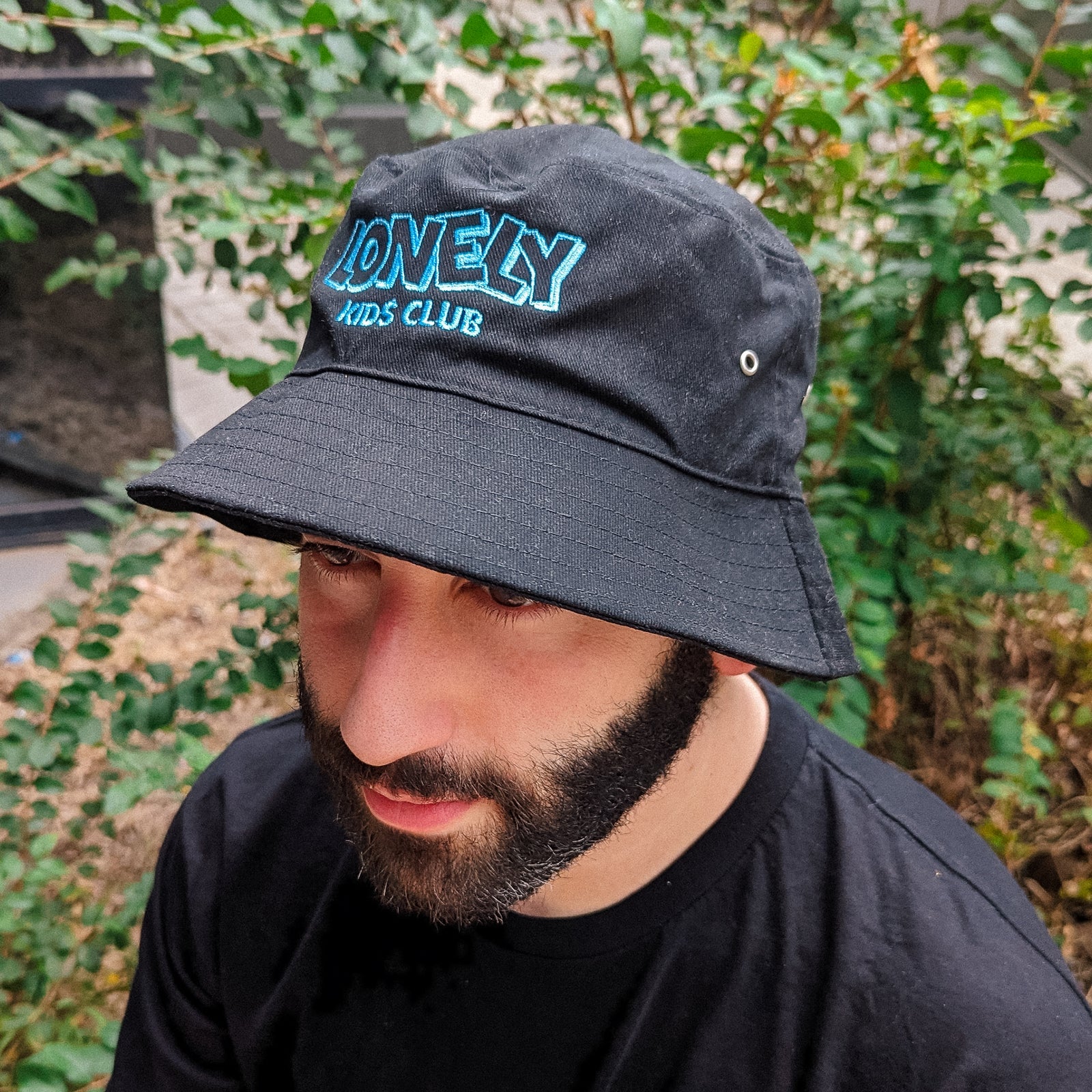 Black bucket hat with LKC Logo Bucket Hat graphic by Lonely Kids Club