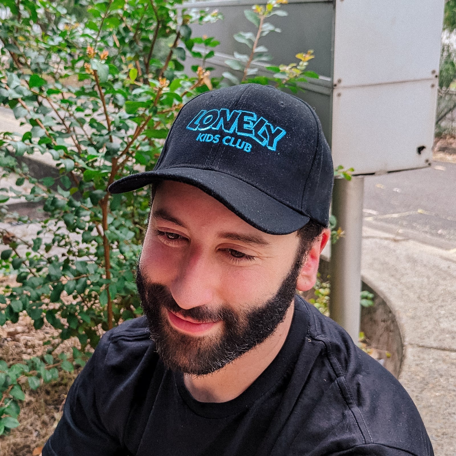 Black cap with LKC Logo Cap graphic by Lonely Kids Club