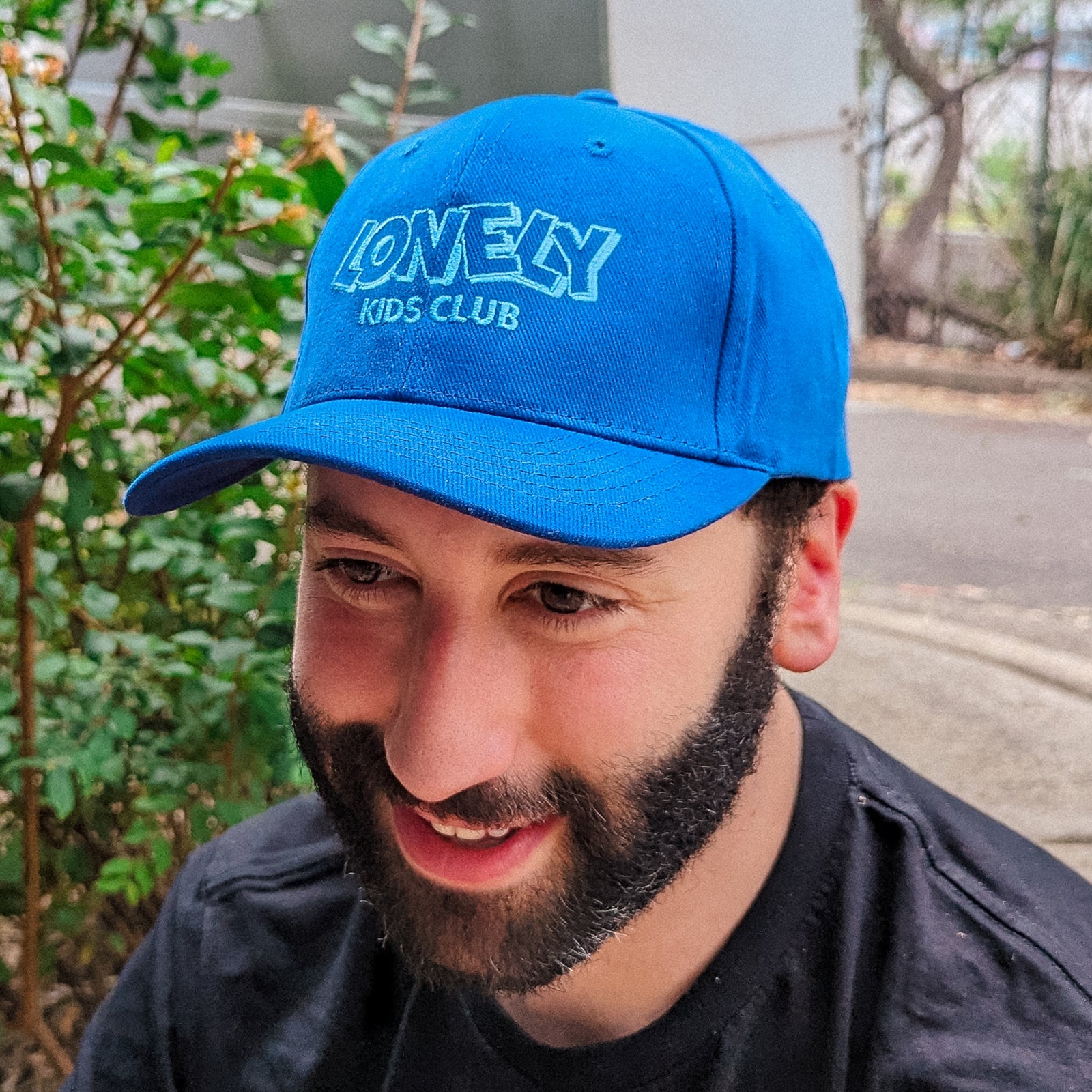 Royal Blue cap with LKC Logo Cap graphic by Lonely Kids Club