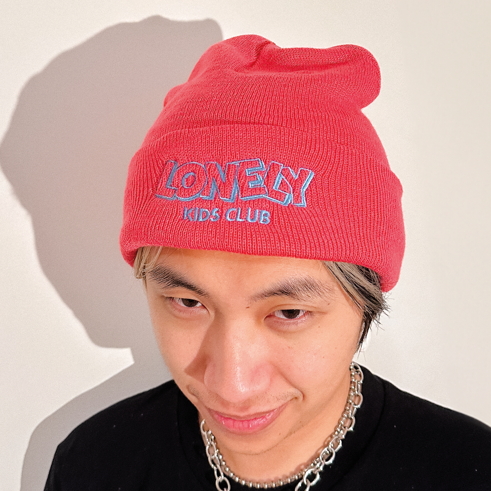 Pink beanie with LKC Logo Beanie graphic by Lonely Kids Club