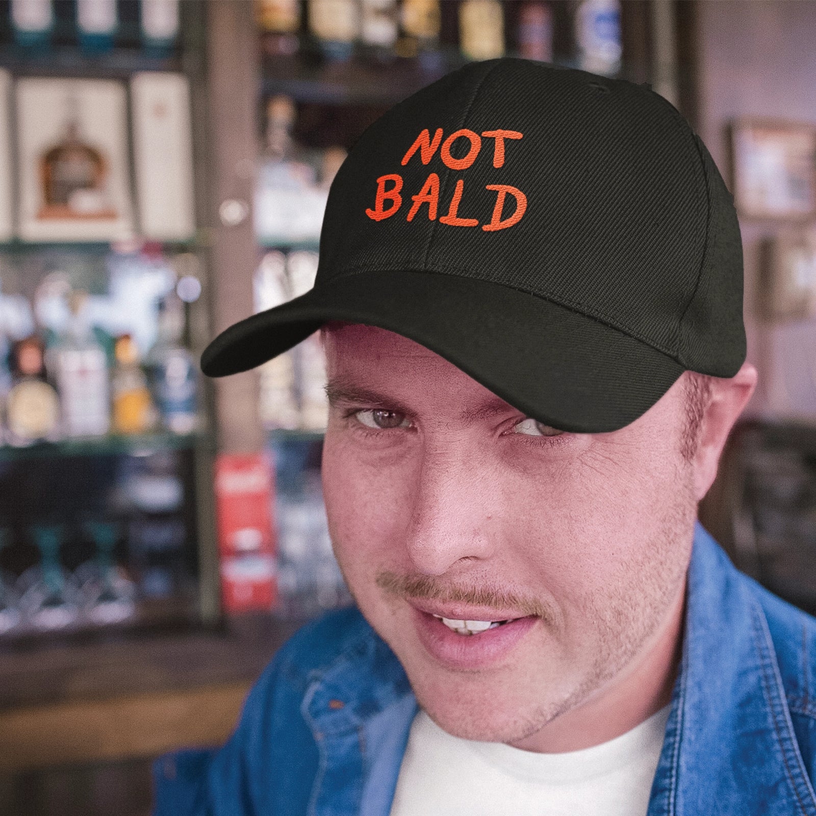 Black classic cap with Not Bald Hat graphic by Lonely Kids Club