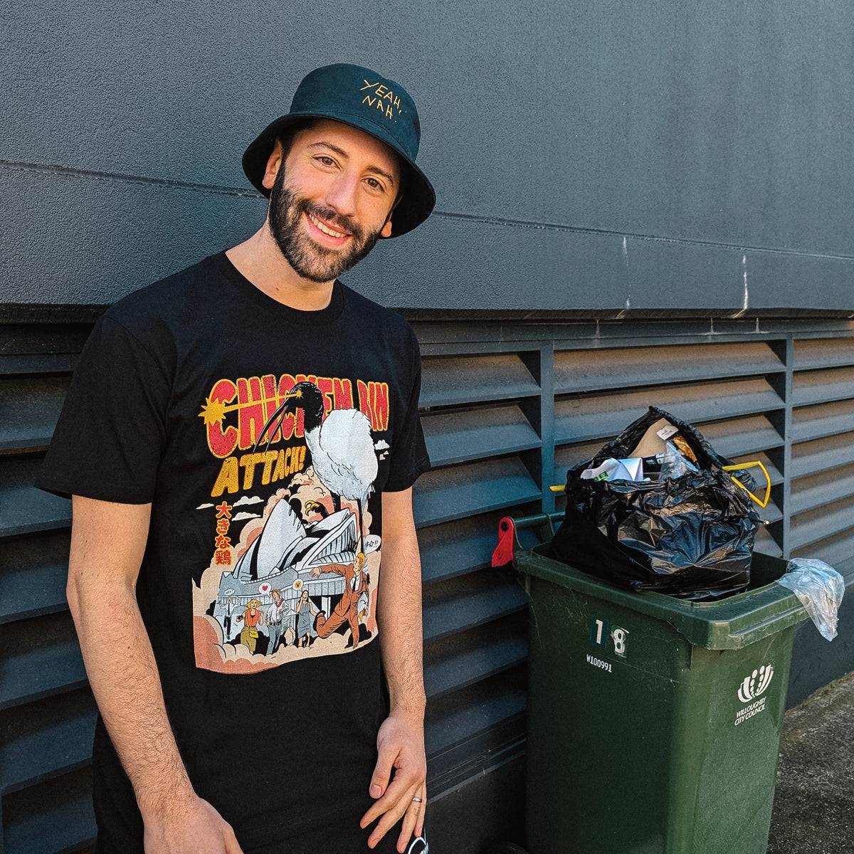 Black unisex t-shirt with Chicken Bin Attack graphic by Lonely Kids Club