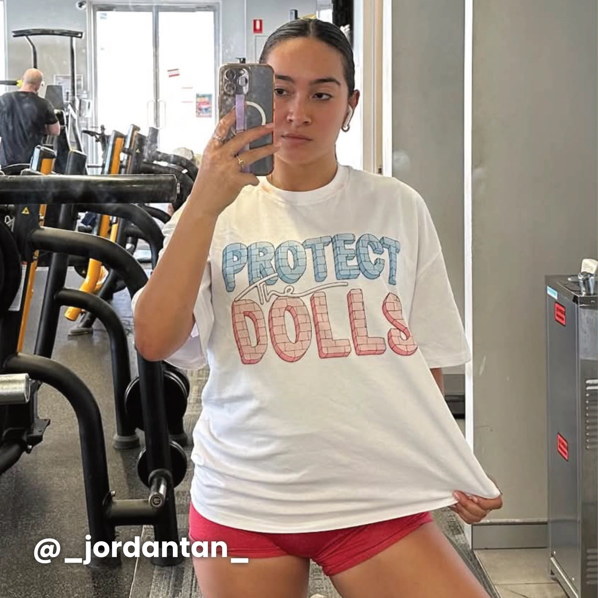 White oversized t-shirt with Protect The Dolls graphic by Lonely Kids Club