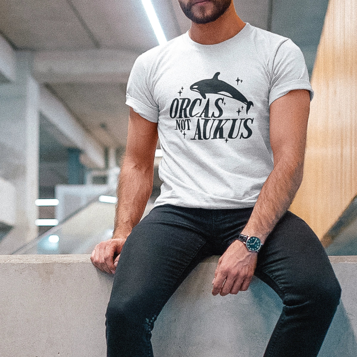 White unisex t-shirt with Orcas Not AUKUS graphic by Lonely Kids Club