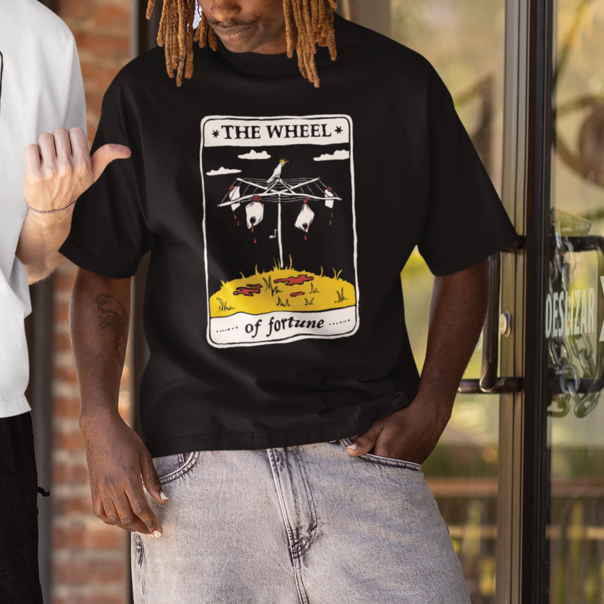 Black oversized t-shirt with The Wheel Tarot graphic by Lonely Kids Club