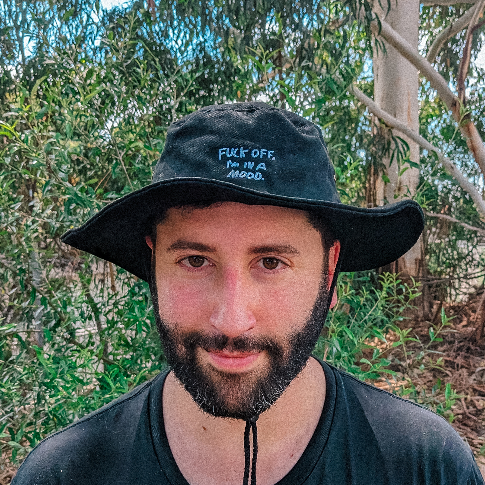 Black hat with Fuck Off Sun Hat graphic by Lonely Kids Club