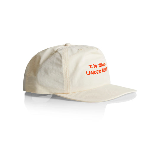 I'm Bald Under Here Cap by Lonely Kids Club. All clothing from our T-shirts to our shorts and hoodies are ethically made, and printed packed and shipped from Sydney.