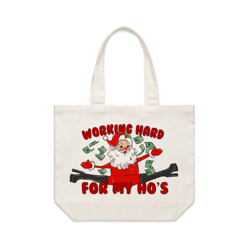 Working Hard For My Ho's Tote by Lonely Kids Club. All clothing from our T-shirts to our shorts and hoodies are ethically made, and printed packed and shipped from Sydney.