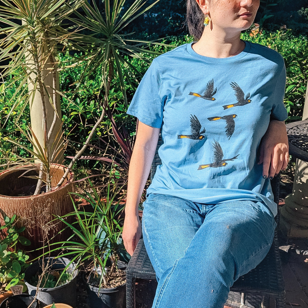Carolina Blue fitted womens t-shirt with Yellow Tailed Black Cockatoos graphic by Lonely Kids Club